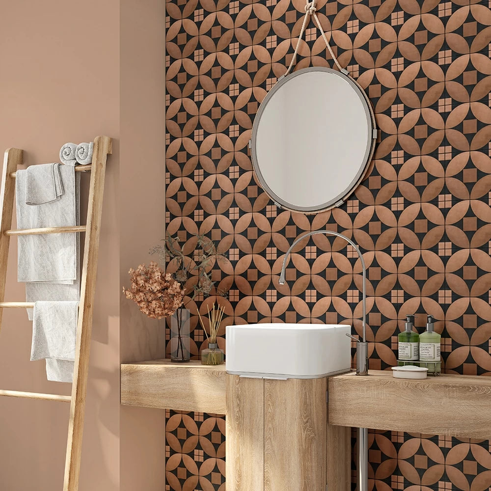 Bathroom with patterned wall tiles, round mirror, wooden countertop, white sink, dried flowers, wooden ladder with white towels.