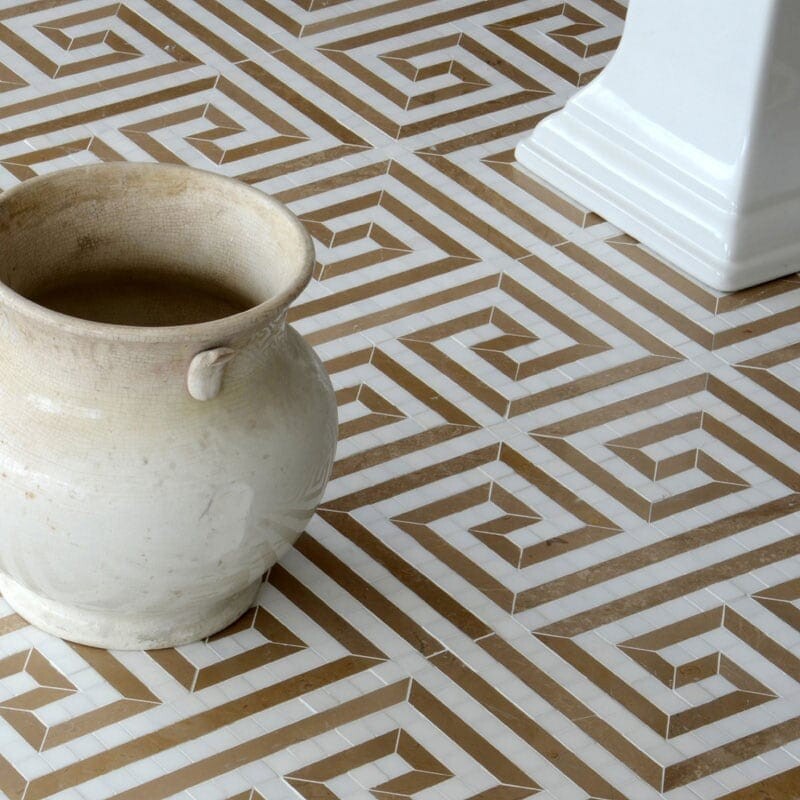 Beige and white geometric tile floor with rustic pot and white pillar base.