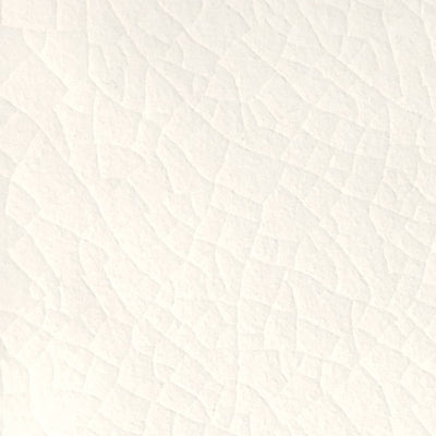 Close-up of Navajo White ceramic tile showcasing subtle texture and slight color variations, ideal for modern and rustic interior designs.
