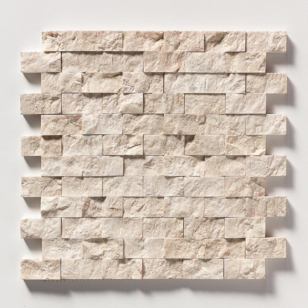 Sample tile collection with rectangular tiles in cream and beige shades, textured surface, staggered pattern.