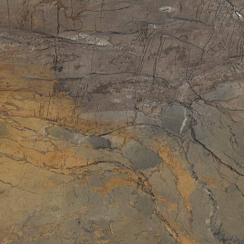 A close-up image of a porcelain tile with a richly textured surface pattern resembling natural marble. The design features a blend of brown, beige, and gray hues with intricate veining and variation, evoking an organic, stone-like appearance. |