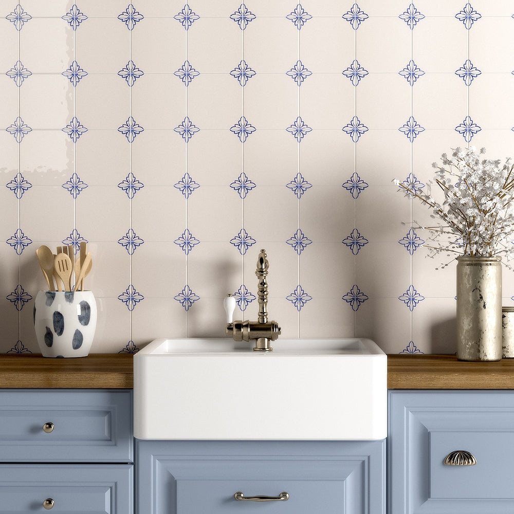 White ceramic kitchen wall with blue glazed decorative tiles.