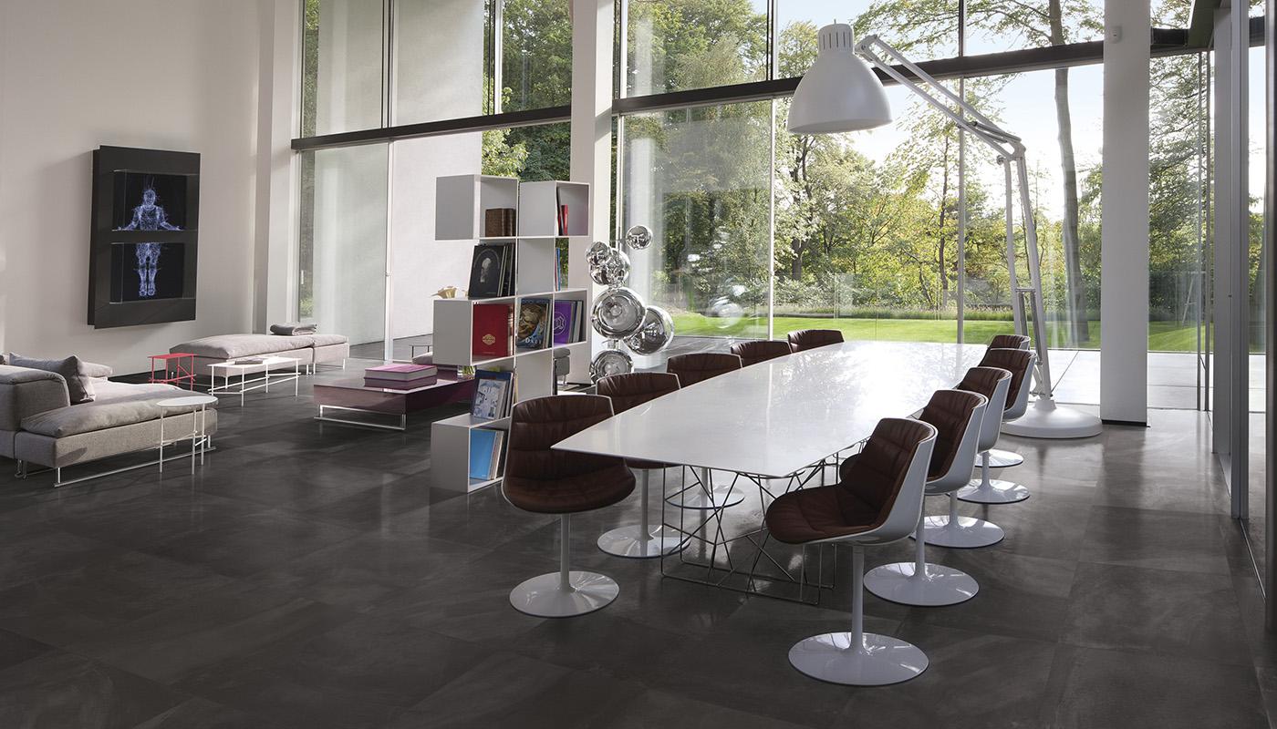 Modern minimalist dining room with high-end Italian porcelain tile flooring from Emil Ergon Architect Resin Collection