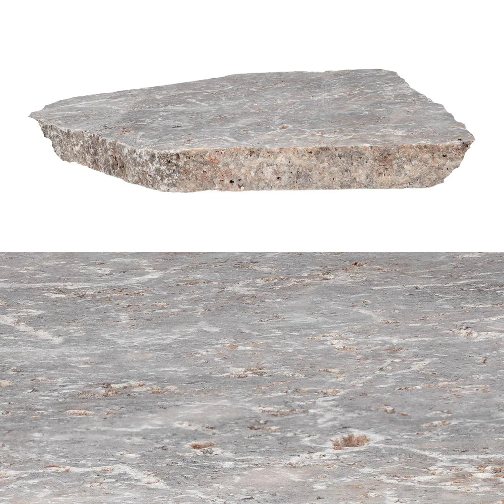 Natural flagstone patio with irregular slabs, enhancing outdoor space with durability and elegance.