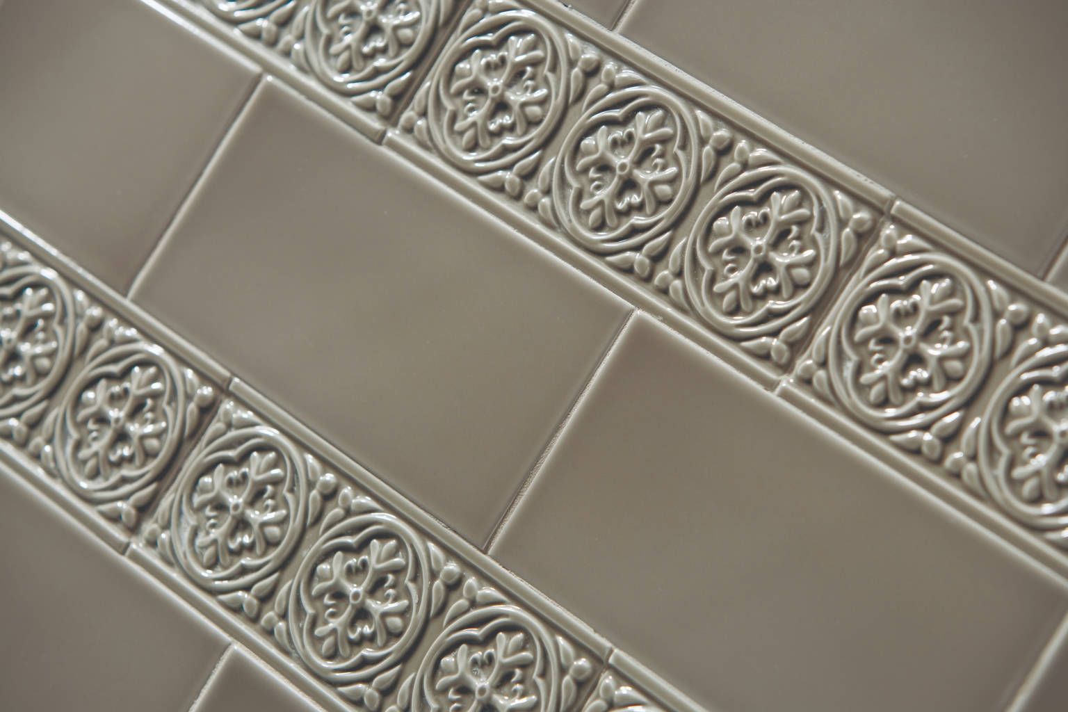 Decorative border tiles for seamless transitions in tile installations, enhancing design aesthetics.