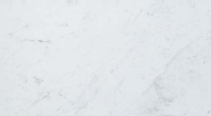 Elegant matte Carrara marble-look porcelain tile with subtle veining, exuding timeless sophistication for refined interiors.