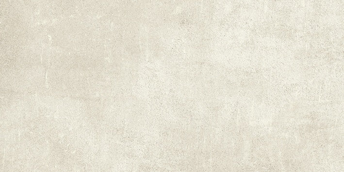 Handcrafted concrete-look porcelain tile in soft beige with delicate reliefs and subtle urban texture for refined minimalist spaces.