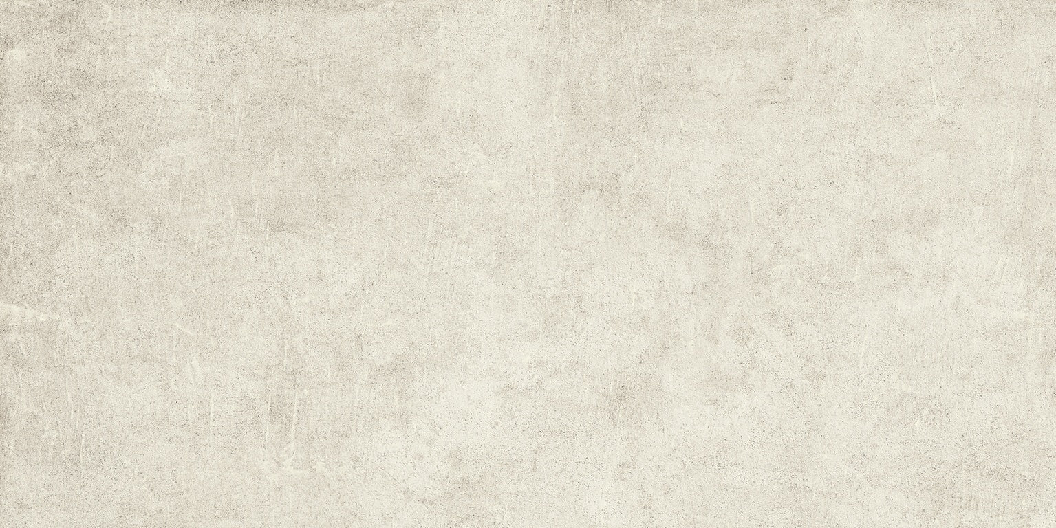 A serene, handcrafted concrete-look porcelain tile in soft beige with delicate reliefs and subtle urban texture for refined interiors.