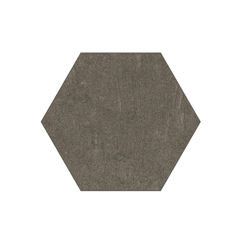 Hexagonal porcelain tile in storm brown with a handcrafted urban concrete look, delicate reliefs, and a refined matte finish.