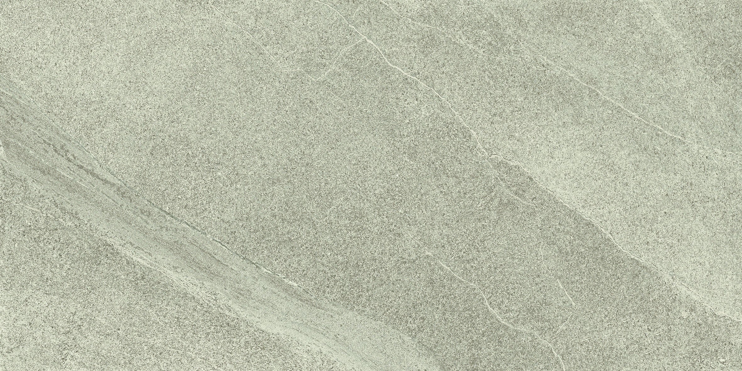 A matte porcelain tile in soft green with the organic texture of limestone, featuring delicate quartz grains for refined, natural elegance.