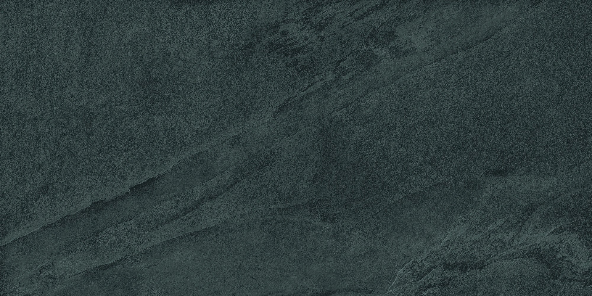Matte gray porcelain tile with refined slate-inspired texture, deep foliated hues, and subtle strength for serene, elegant interiors.