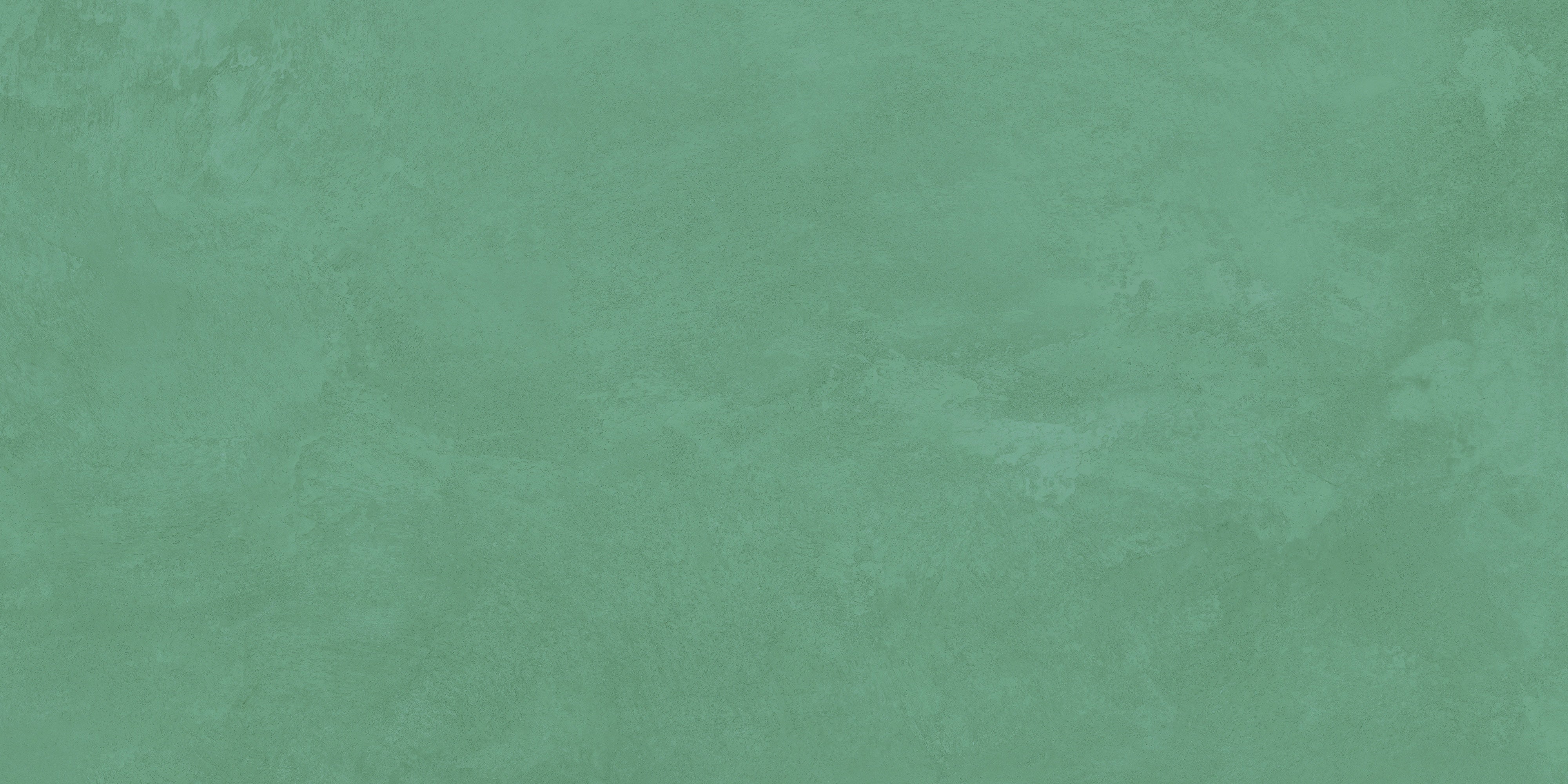 Luxurious matte jade porcelain tile with smooth, earthy texture, evoking serene harmony and timeless organic elegance in contemporary spaces.