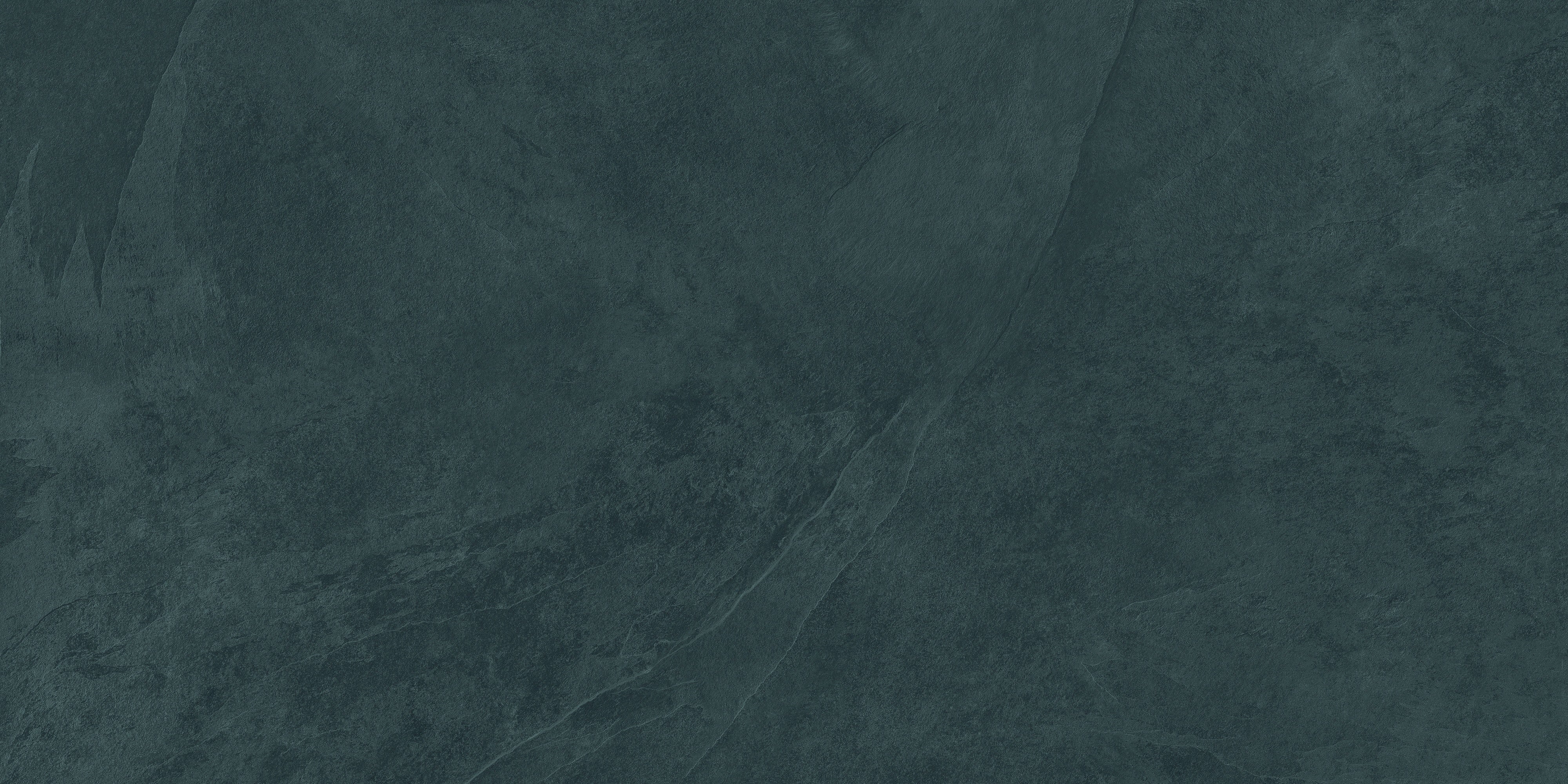 Matte blue slate-look porcelain tile with foliated texture, exuding serene elegance and subtle strength for refined modern interiors.