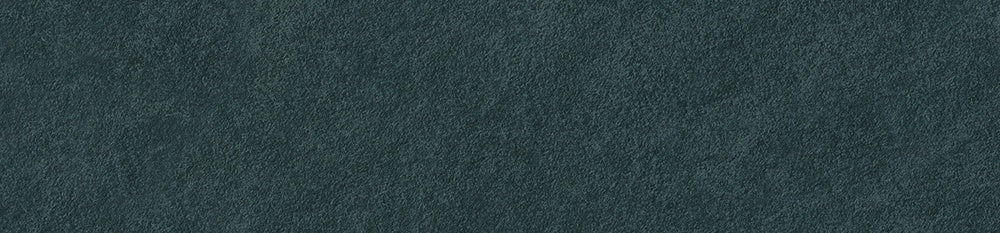 Matte blue slate-look porcelain tile with foliated texture, exuding serene elegance and subtle strength.