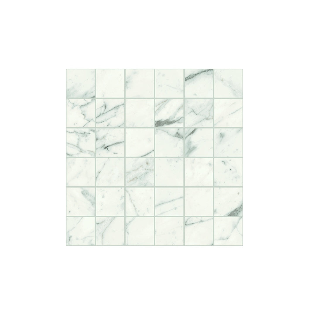 Matte white porcelain mosaic with soft gray veining, evoking Calacatta marble’s serene elegance in a refined straight-stack pattern.