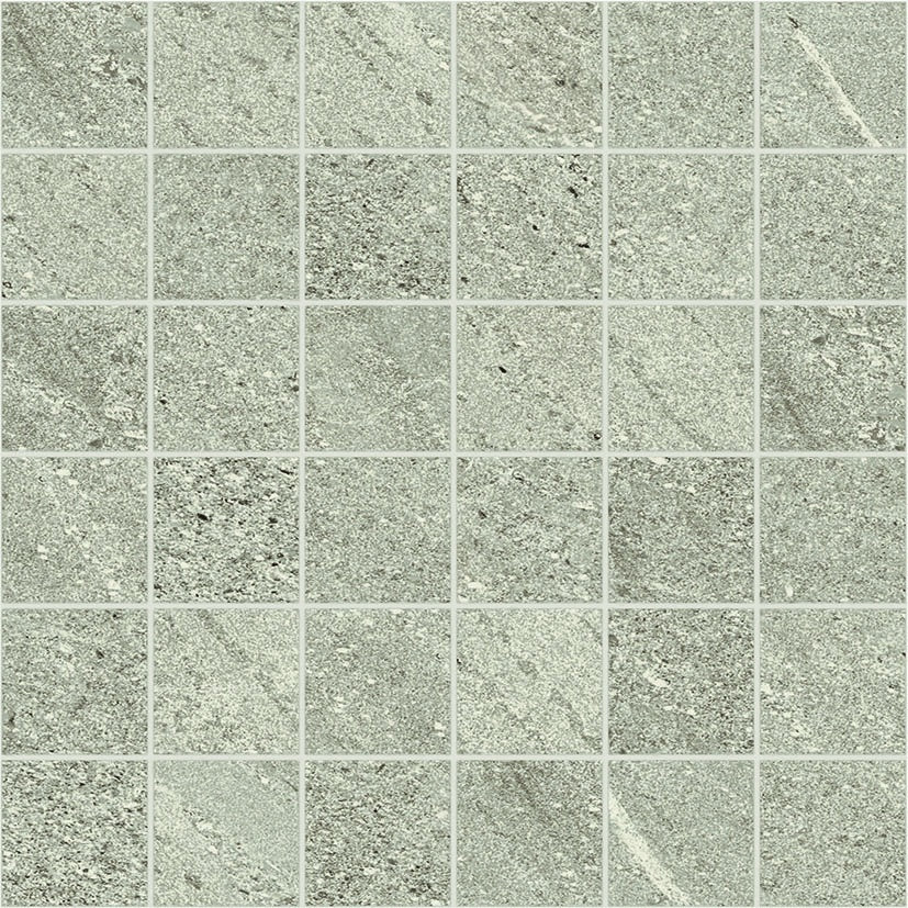 Interlocking square mosaic in soft green limestone-look porcelain with subtle quartz grains, matte finish, elegant and organic.