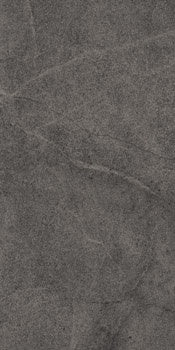 Elegant matte limestone-look porcelain tile in deep bluish-gray, refined rectified edges, serene crystalline texture.
