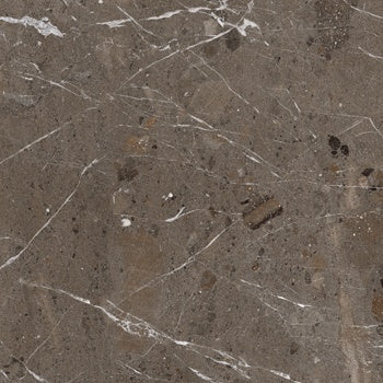 Matte taupe porcelain tile with refined marble veining, embodying earthy sophistication and industrial elegance for modern interiors.