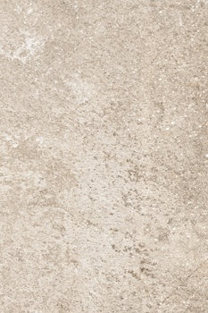 Matte porcelain tile with rugged dolomite texture in warm beige, evoking Appalachian stone’s raw, timeless strength.
