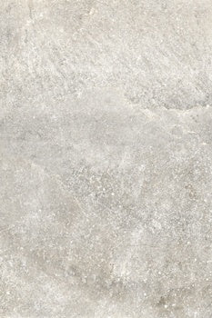 Matte gray porcelain tile with a rugged dolomite texture, evoking the raw strength of Appalachian stone in an organic-modern aesthetic.