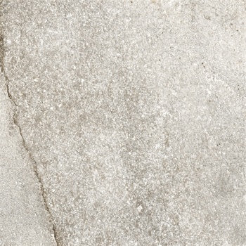 Matte-finish porcelain tile with a slate-cut texture, evoking rugged Appalachian dolomite in soft ice-gray tones.