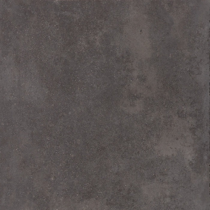 Dark gray full-body porcelain tile with a semi-glossy concrete finish, embodying urban minimalism and brutalist elegance in a monolithic square format.