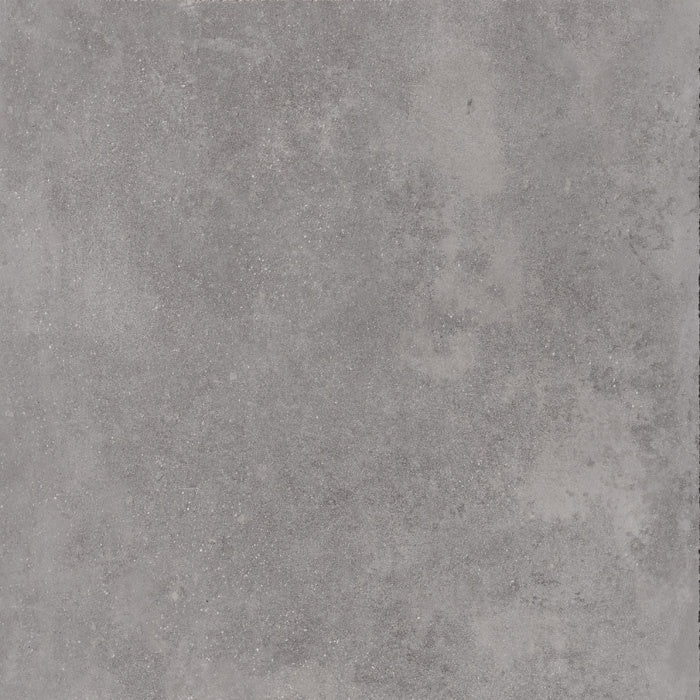 Large-format gray porcelain tile with refined concrete texture and soft sheen, embodying urban minimalism and brutalist elegance.