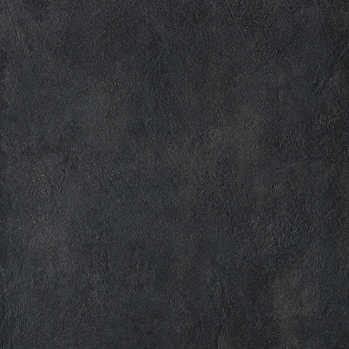 Large-format matte black porcelain tile with refined concrete texture, embodying urban minimalism and brutalist elegance.