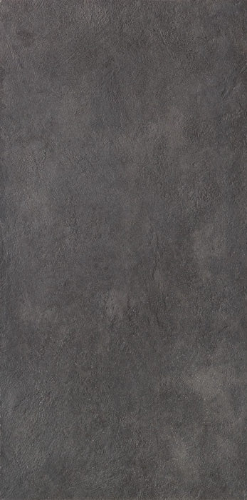 Full-body porcelain tile in dark grey with a matte concrete finish, embodying urban minimalism and brutalist elegance.