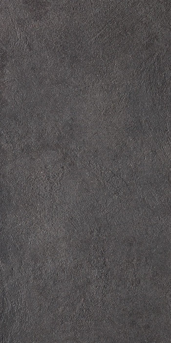 Matte dark gray porcelain tile with refined concrete texture, embodying urban minimalism and brutalist elegance in a sleek, monolithic form.