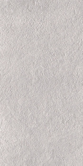 Matte white porcelain tile with bush-hammered texture, evoking raw concrete elegance for refined minimalist interiors.