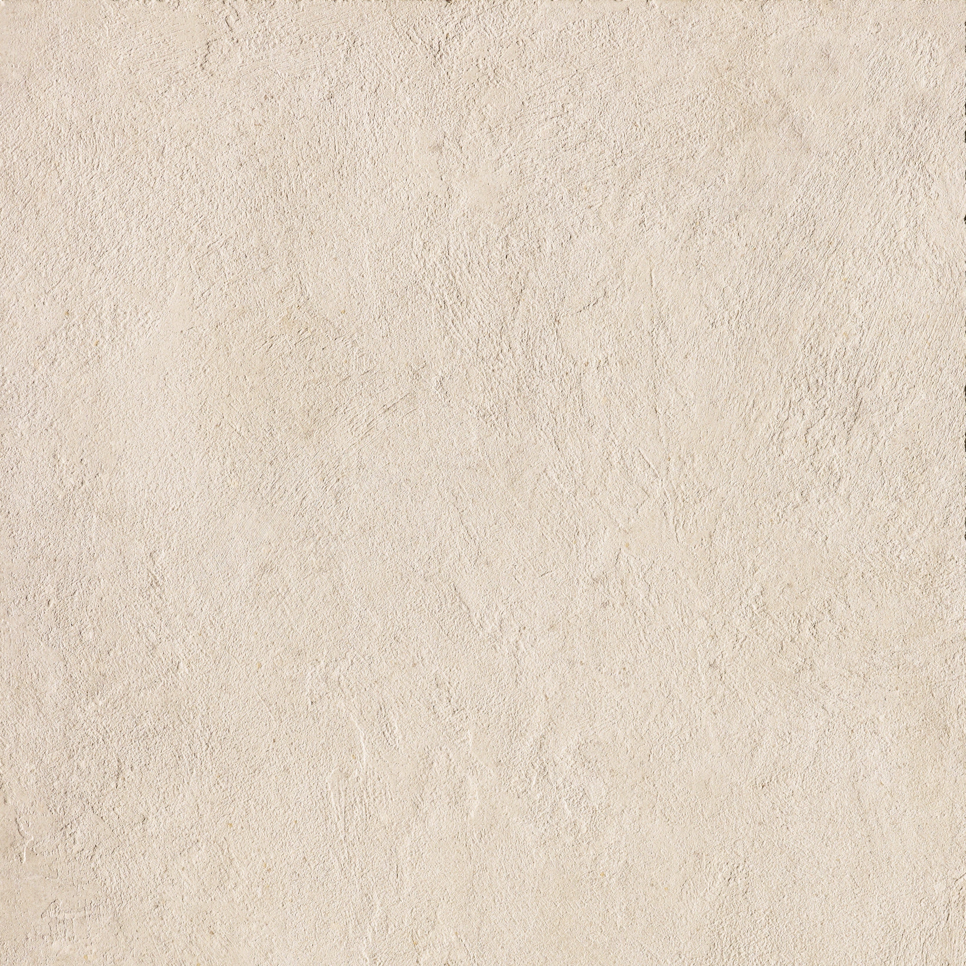 Matte almond porcelain tile with bush-hammered texture, exuding urban minimalism and brutalist elegance in warm concrete tones.