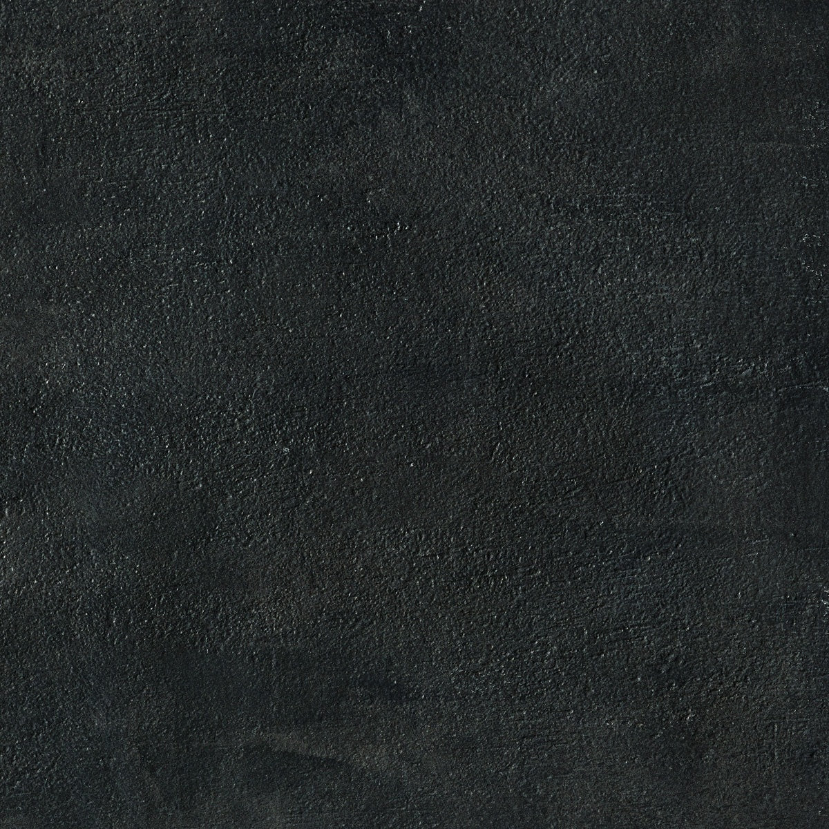 Matte black porcelain bullnose trim with refined concrete texture, embodying urban elegance and minimalist sophistication.