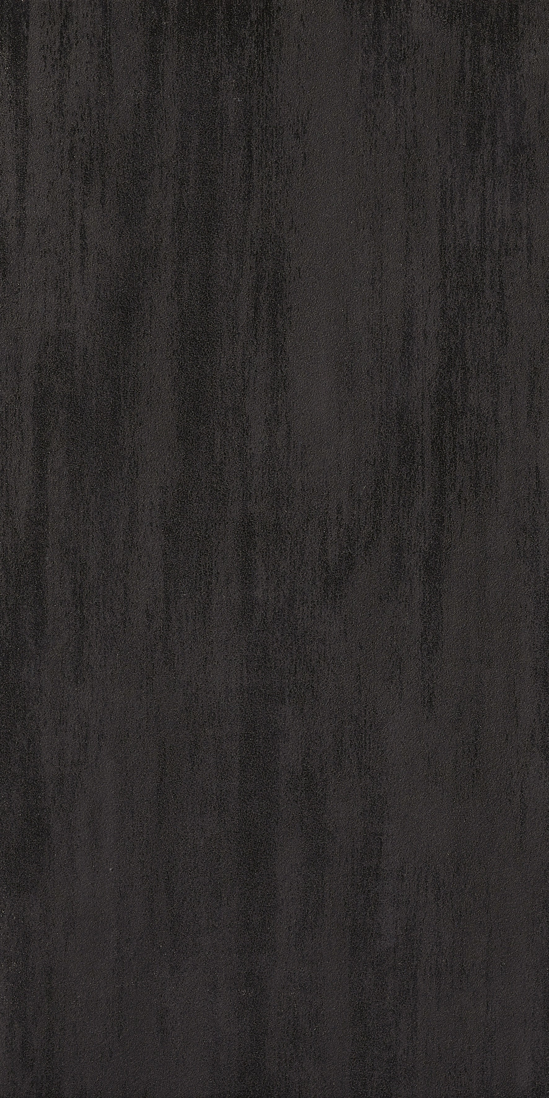 Black matte porcelain tile with a refined, minimalist aesthetic, offering timeless sophistication and sleek durability for modern spaces.