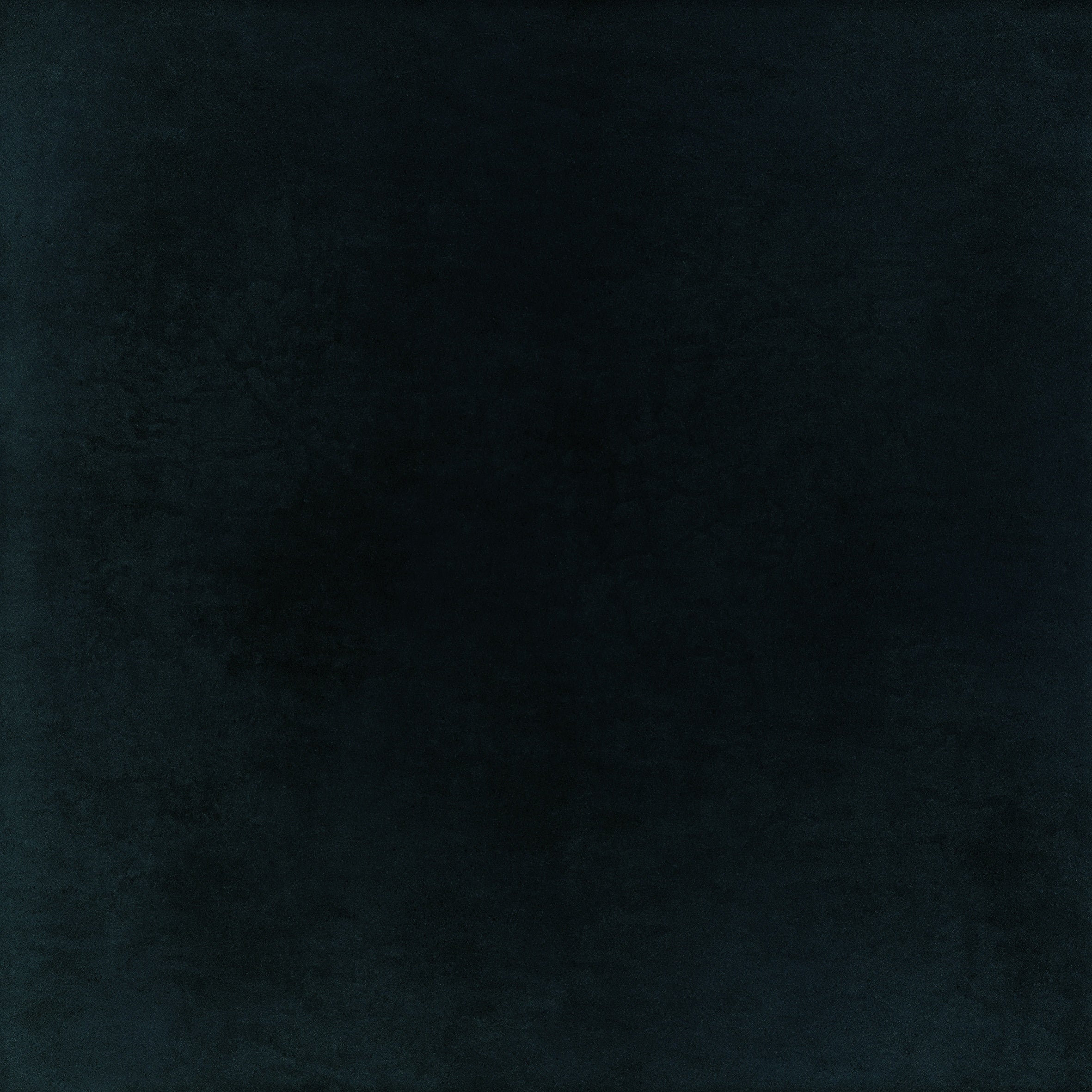 Glossy black full-body porcelain tile with a sleek, minimalist surface, exuding modern sophistication and timeless luxury.