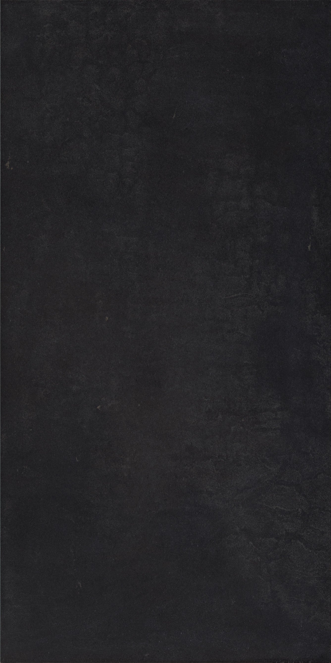 Sleek matte black porcelain tile with a refined, minimalist edge for modern luxury interiors.