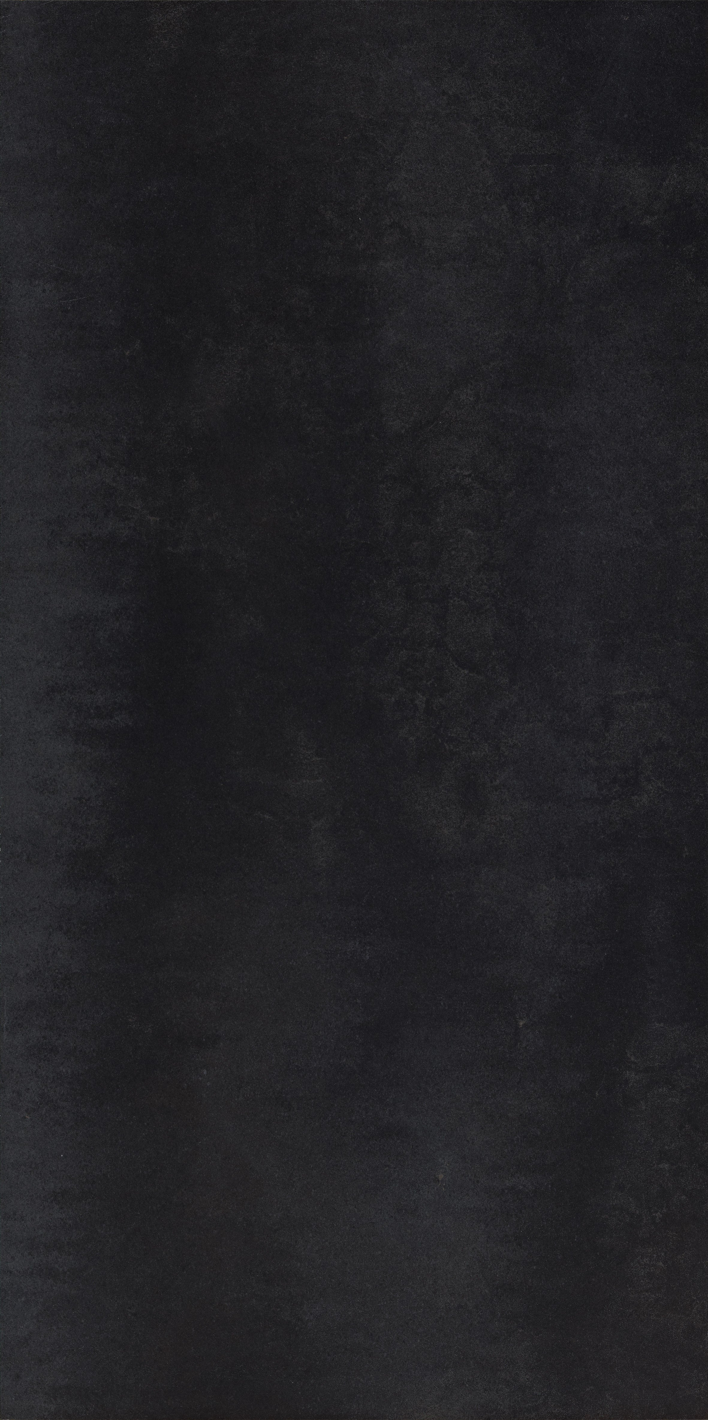 Sleek matte black porcelain tile with a refined, minimalist edge for modern luxury interiors.