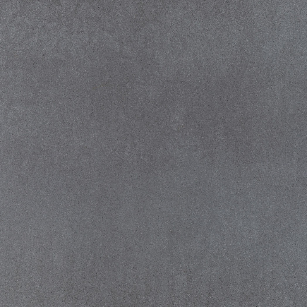 Sleek dark gray full-body porcelain tile with a matte finish, embodying minimalist sophistication for modern interiors.