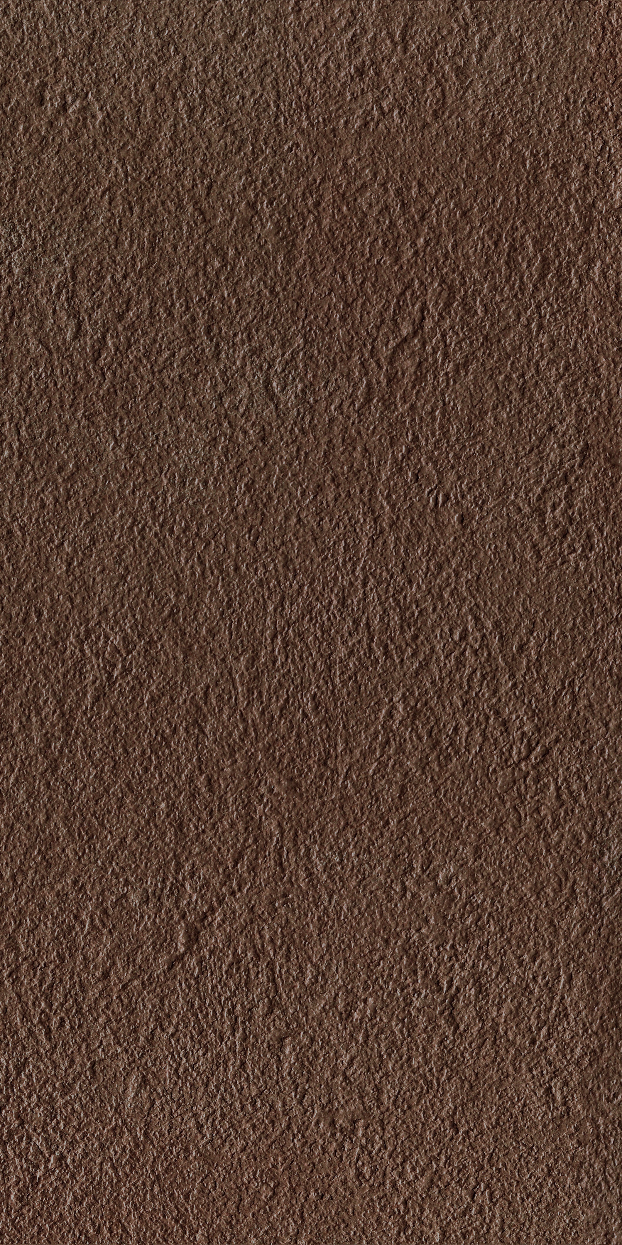 Bush-hammered brown porcelain tile with a matte rustic texture, exuding modern sophistication and timeless durability for refined interiors.