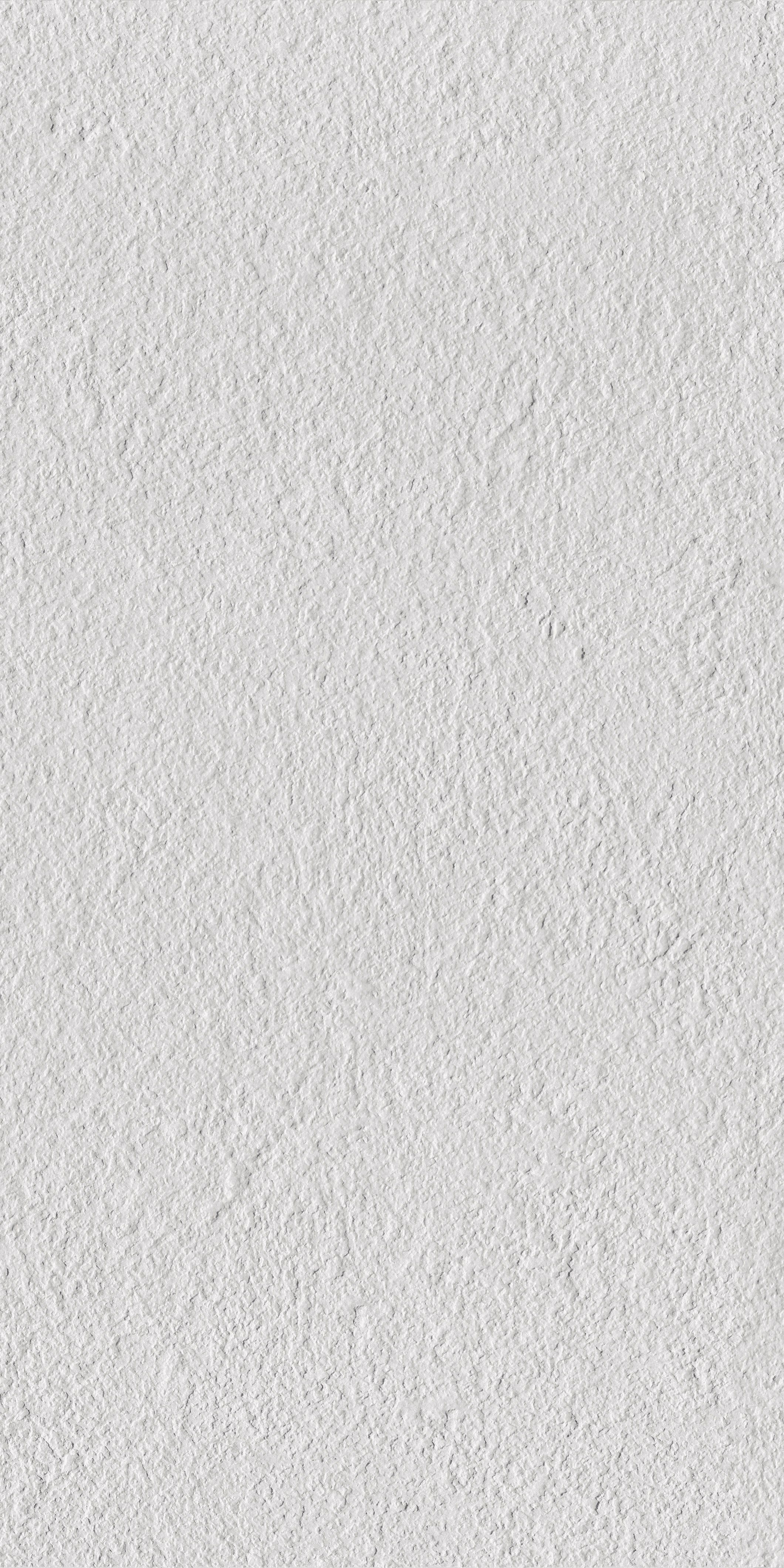 Modern white porcelain tile with a softly textured, bush-hammered matte finish, exuding minimalist sophistication and timeless durability.