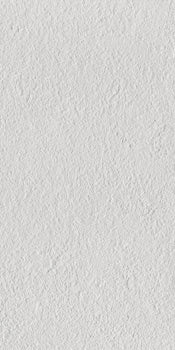 Modern white porcelain tile with a softly textured, bush-hammered matte finish, exuding minimalist sophistication and timeless durability.