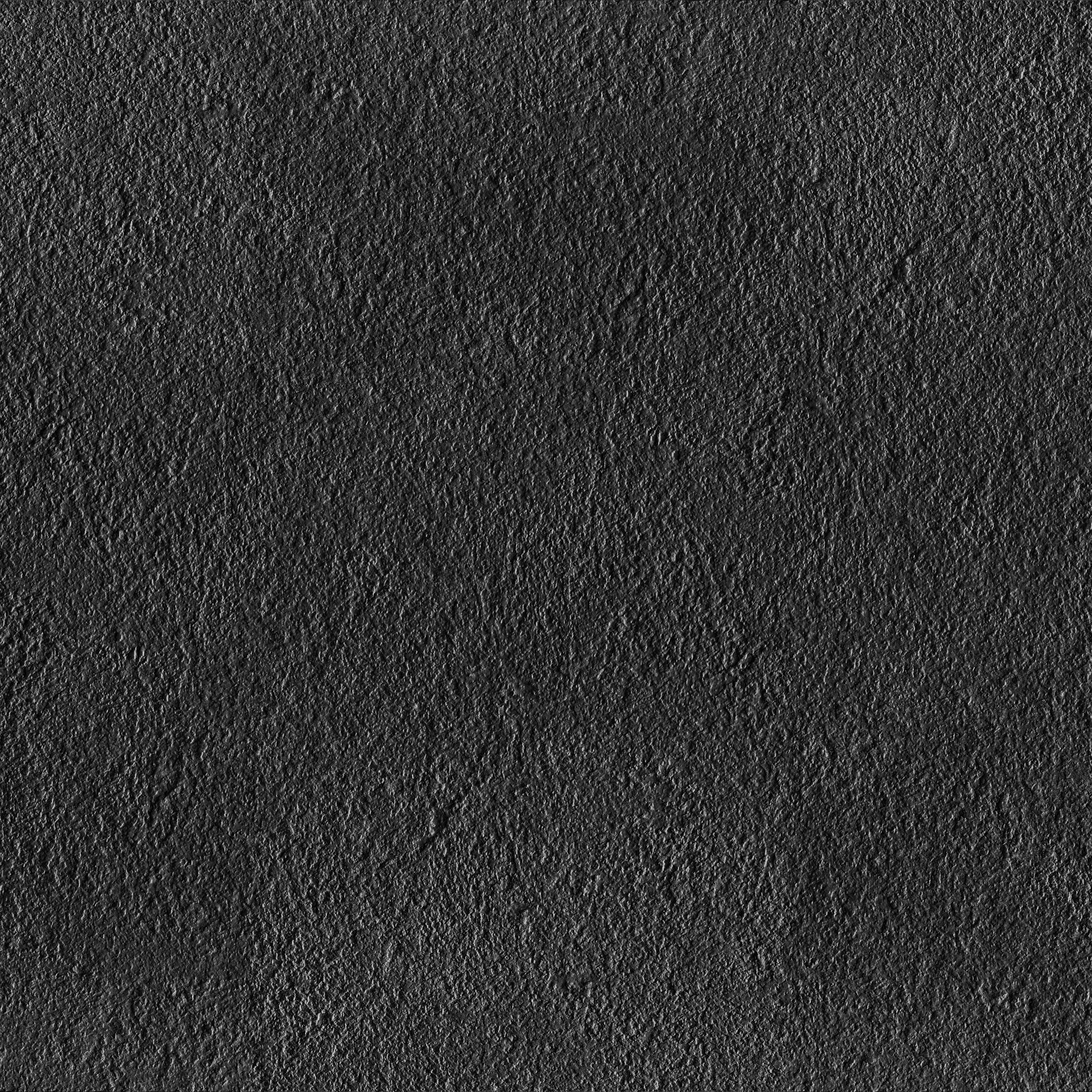 Bush-hammered black porcelain tile with a matte, rustic texture, exuding modern sophistication and timeless durability.