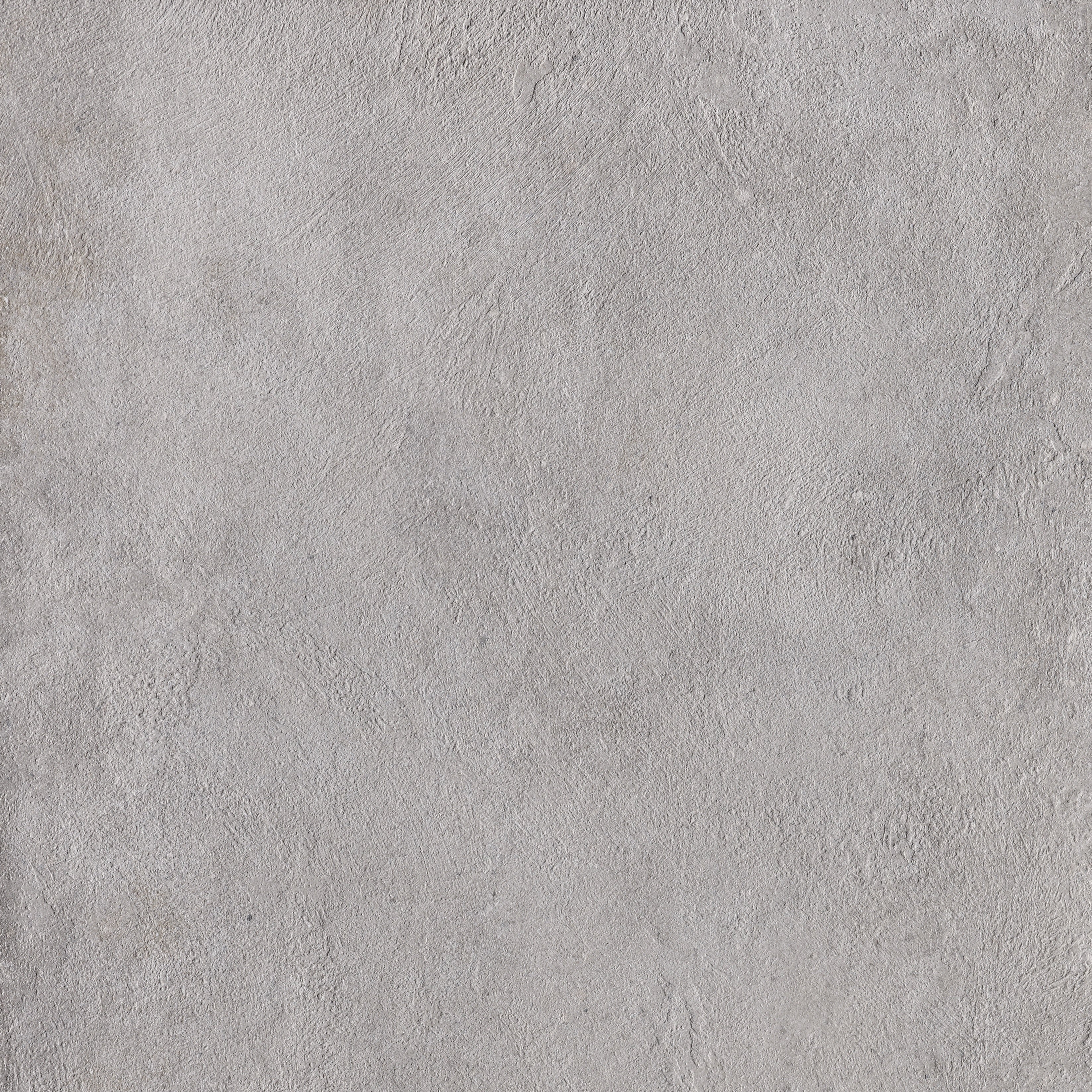 Interlocking gray porcelain mosaic with a soft matte concrete finish, embodying urban minimalism and refined industrial strength.