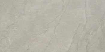 Luxurious matte gray porcelain tile with a soft marble effect, refined open grain, and a timeless, well-worn patina.