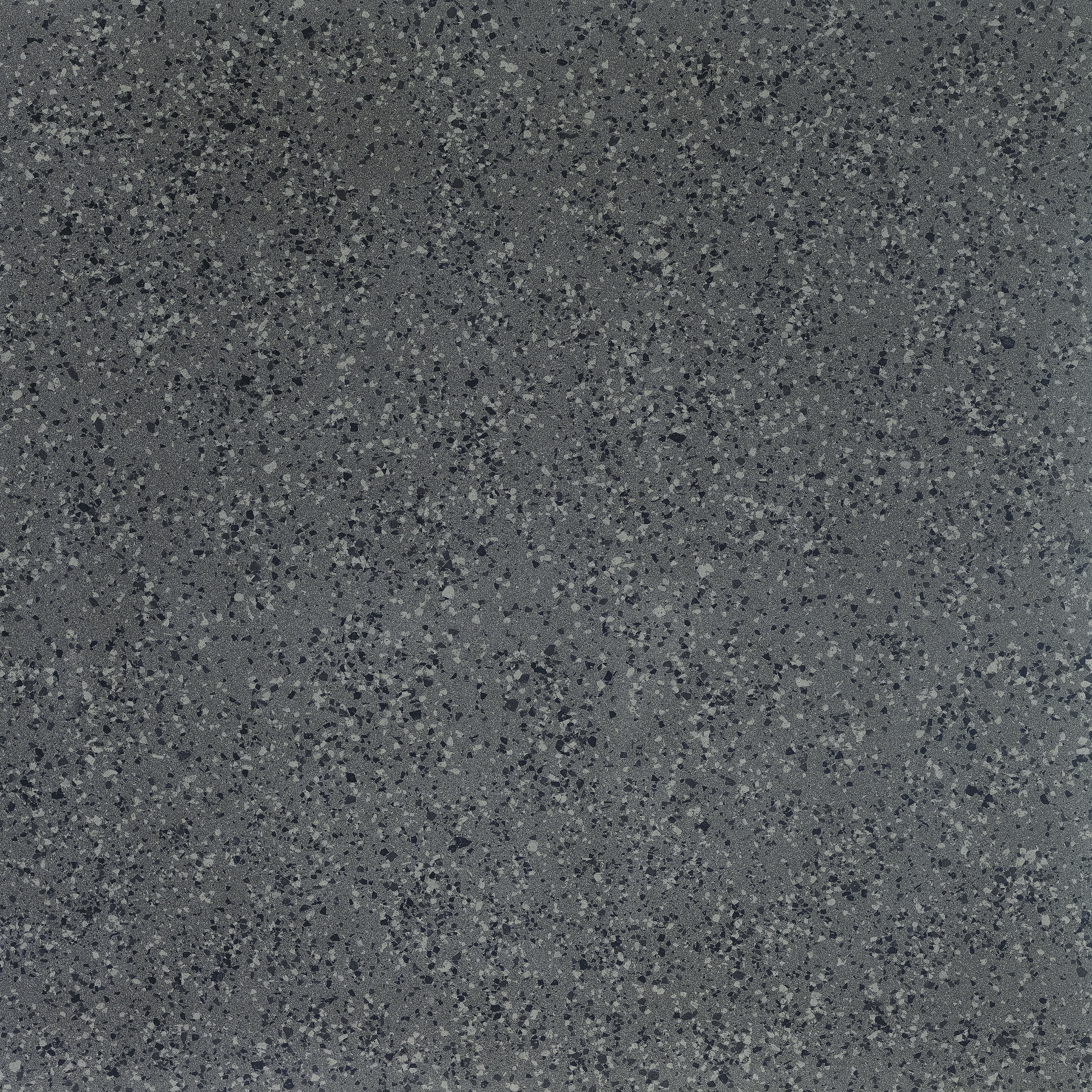 Dark gray porcelain tile with a medium-grain terrazzo look, bush-hammered matte texture, and timeless industrial elegance.