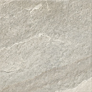 A textured matte porcelain tile in warm white quartzite, evoking natural stone with rustic elegance for refined outdoor spaces.