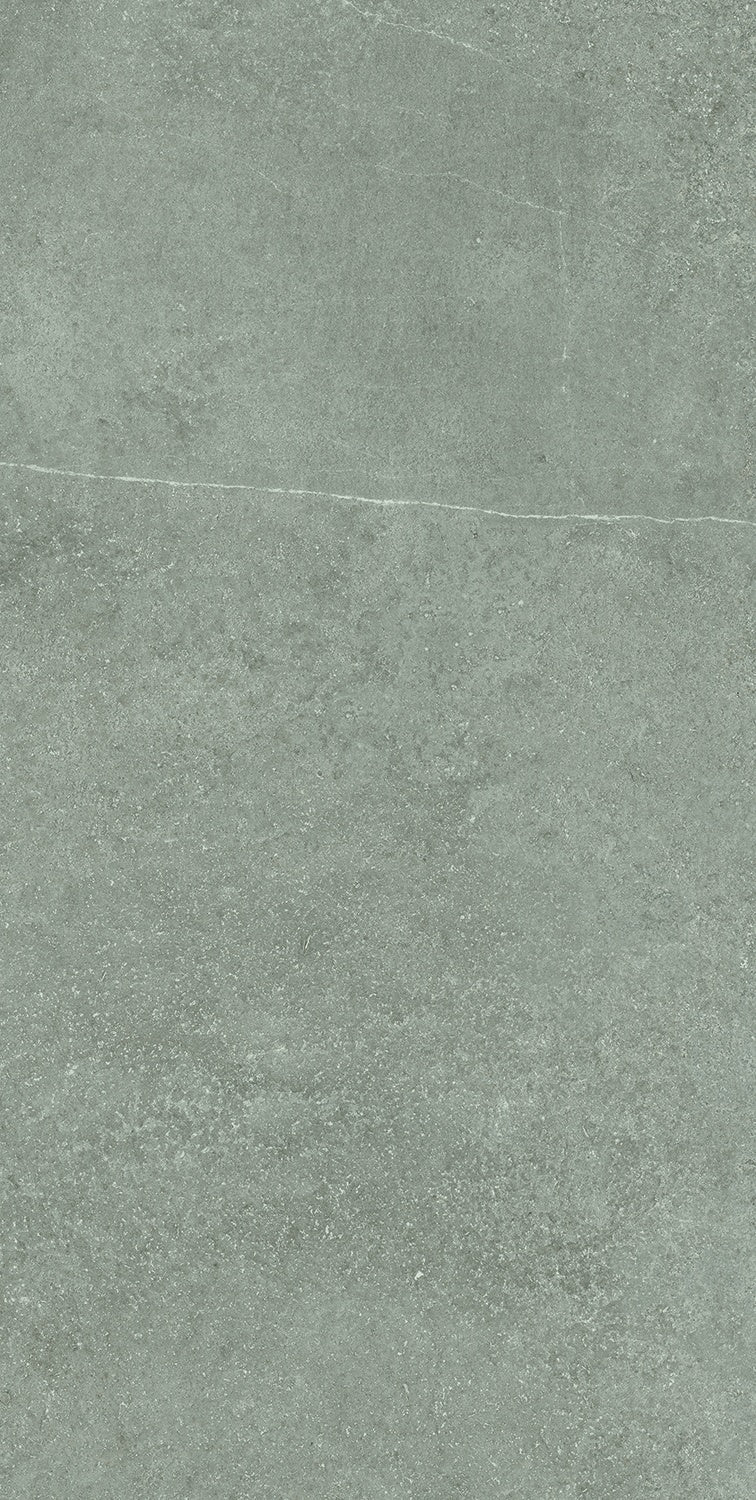 Matte gray porcelain tile with a softly textured concrete aesthetic, refined rectified edges, and understated modern elegance.