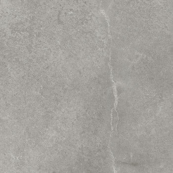 Matte porcelain tile with textured concrete look in soft silver-gray, refined rectified edges, understated luxury for modern interiors.