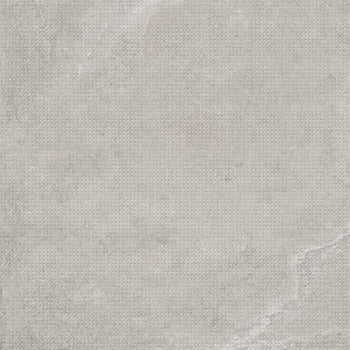 Matte beige porcelain tile with subtle punched dots, offering a refined contemporary texture for elegant, tactile walls.