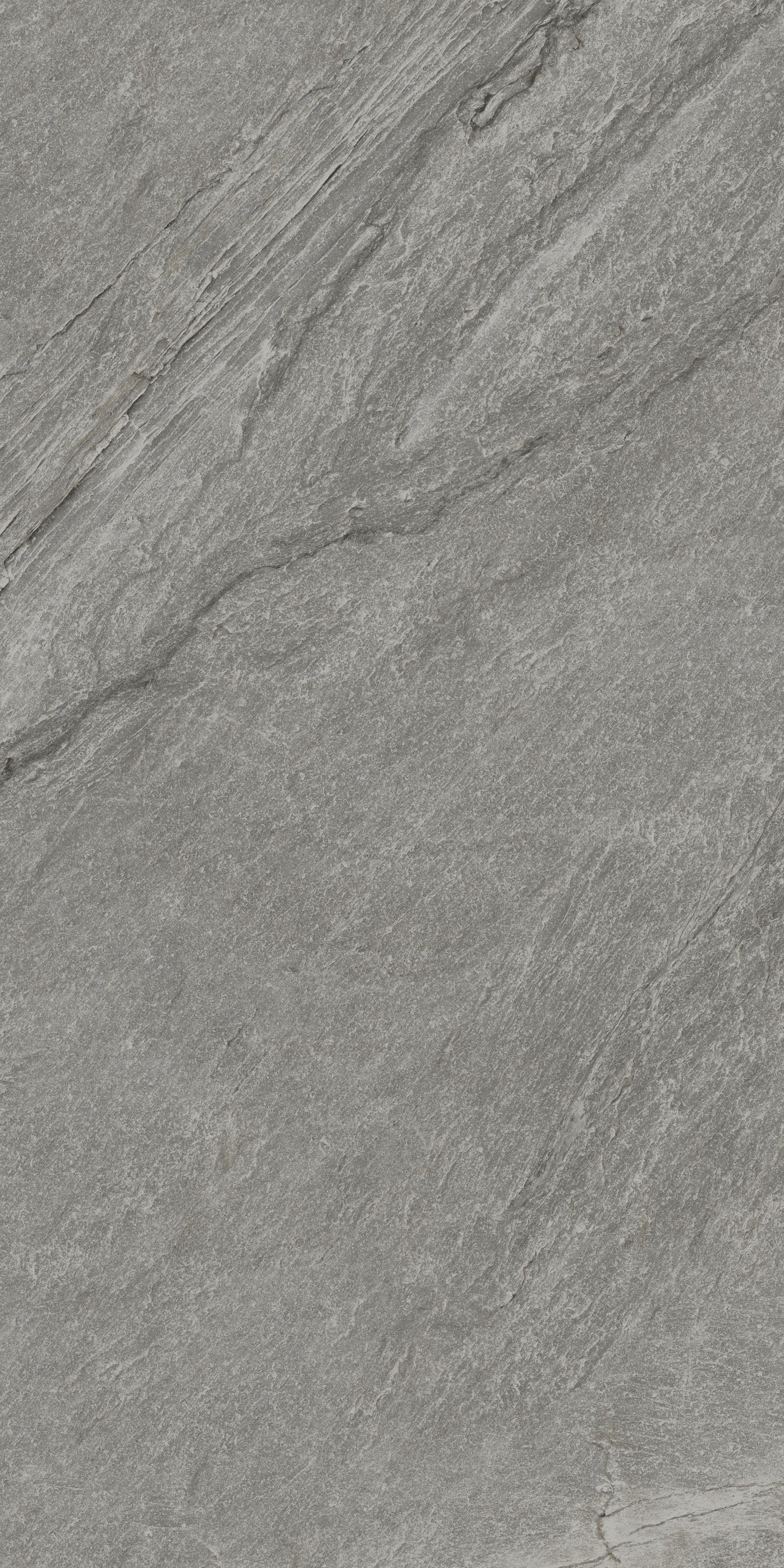 Matte dark gray porcelain tile with primordial quartzite texture, exuding serene depth for intimate, harmonious spaces.
